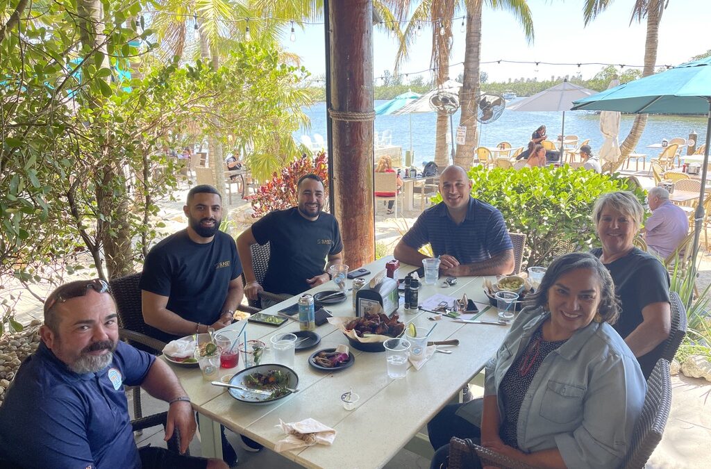 Roger enjoying lunch with a team of installers, discussing installation techniques in the context of team installers vs. independent contractors